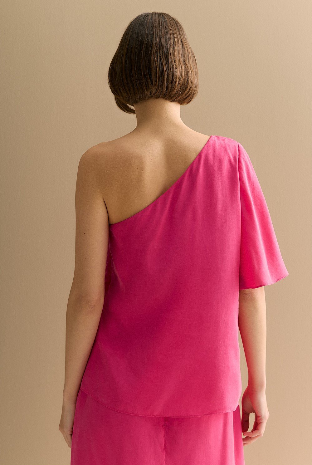 Asymmetric Sleeve Draped Top